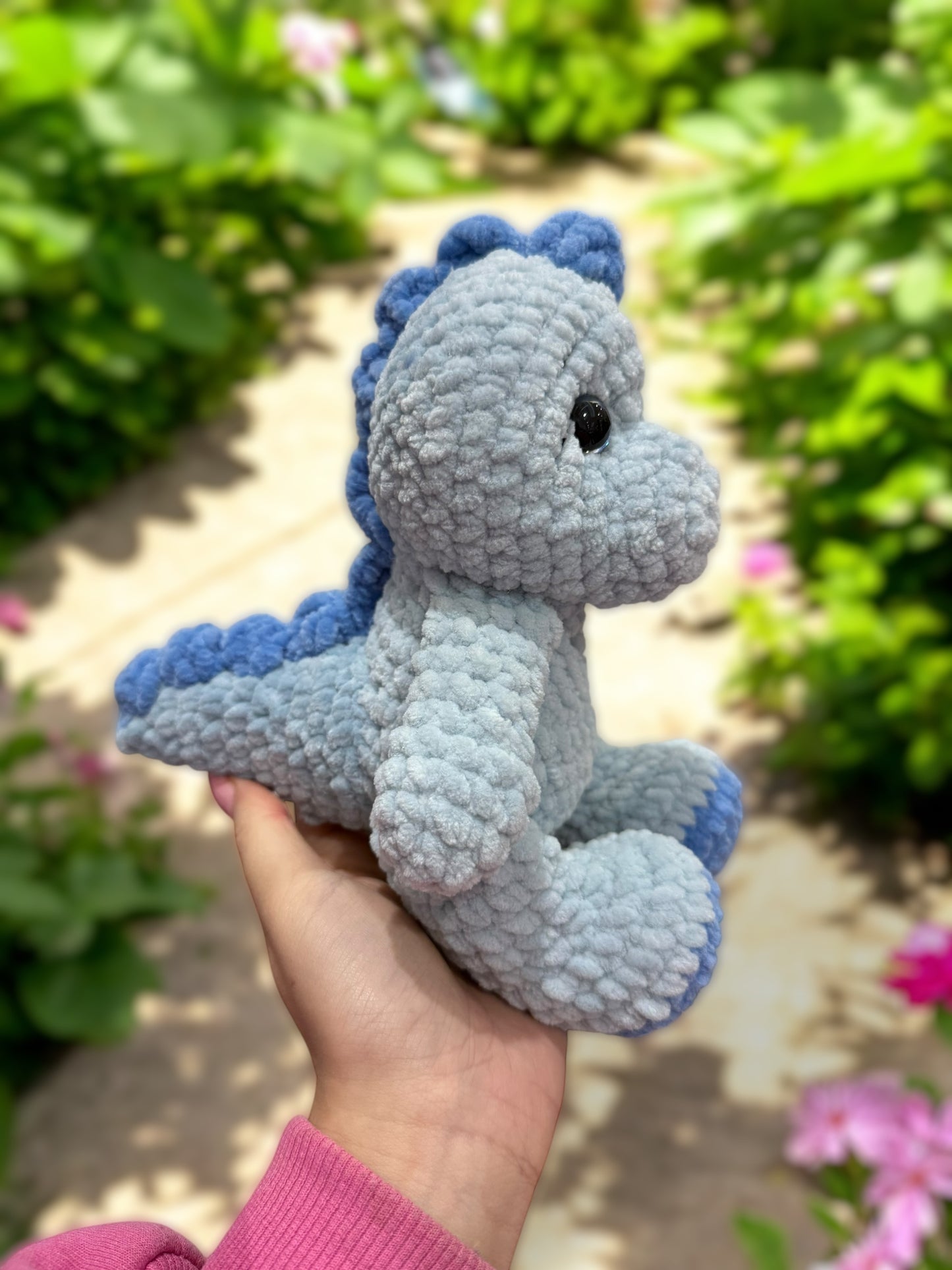Blue dinosaur side tail view